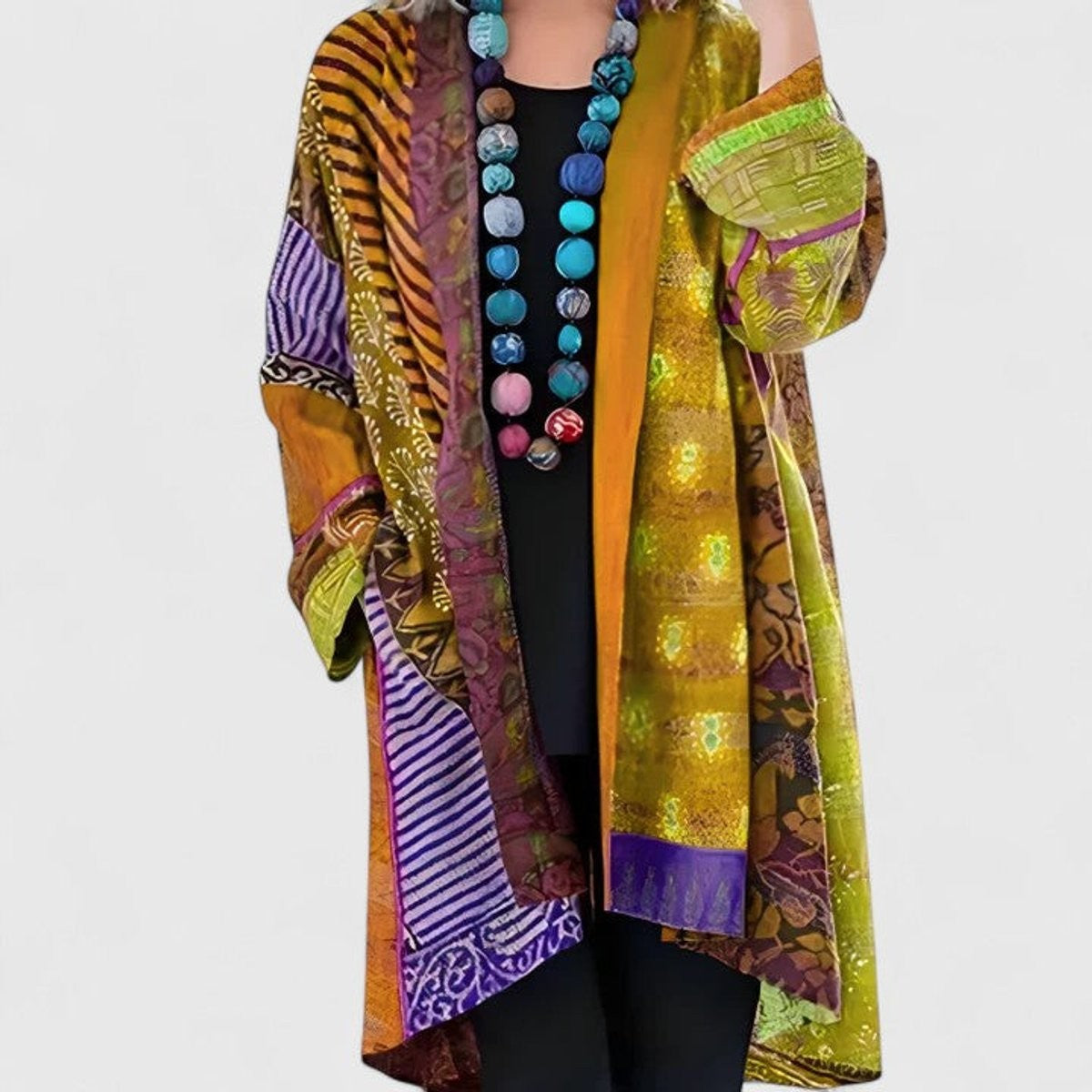 Women's open-front patchwork longline cardigan with patterned panels and long sleeves
