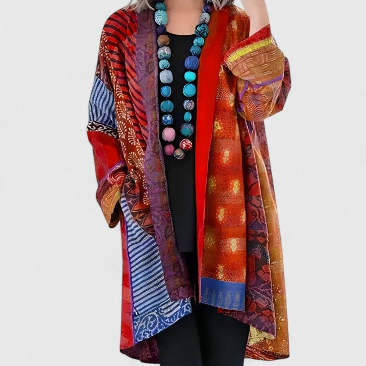 Women's open-front patchwork longline cardigan with patterned panels and long sleeves