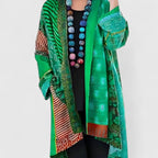 Women's open-front patchwork longline cardigan with patterned panels and long sleeves