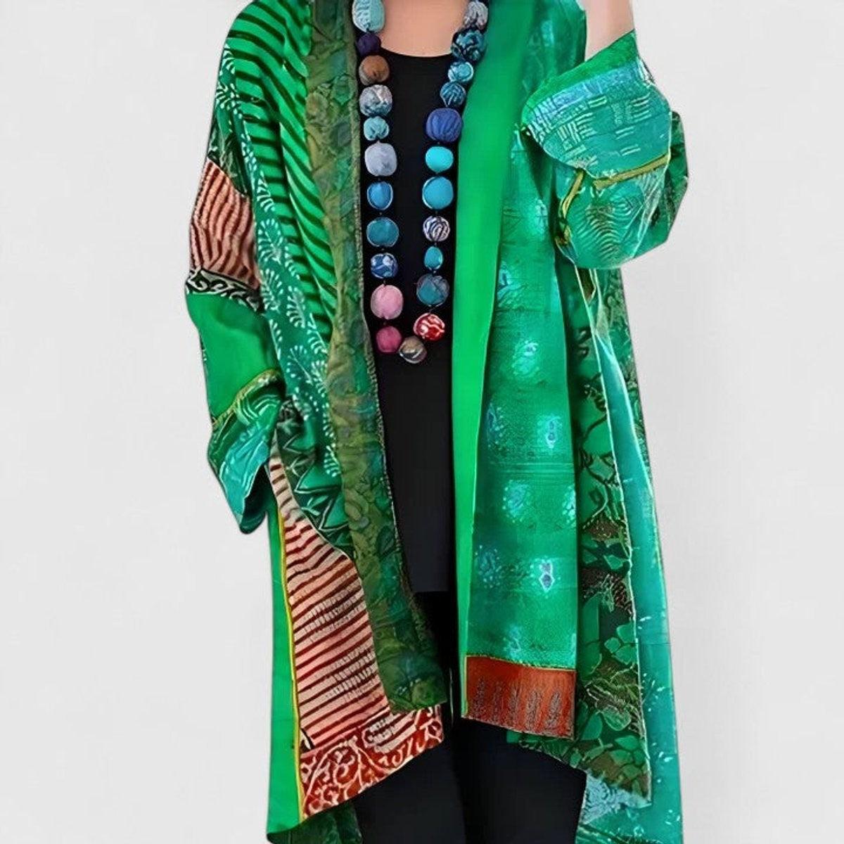 Women's open-front patchwork longline cardigan with patterned panels and long sleeves