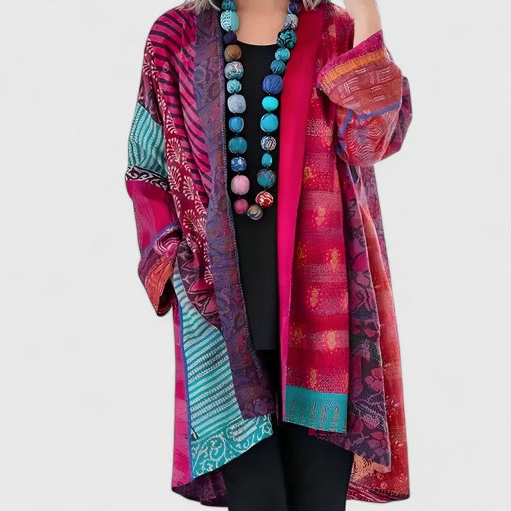 Women's open-front patchwork longline cardigan with patterned panels and long sleeves