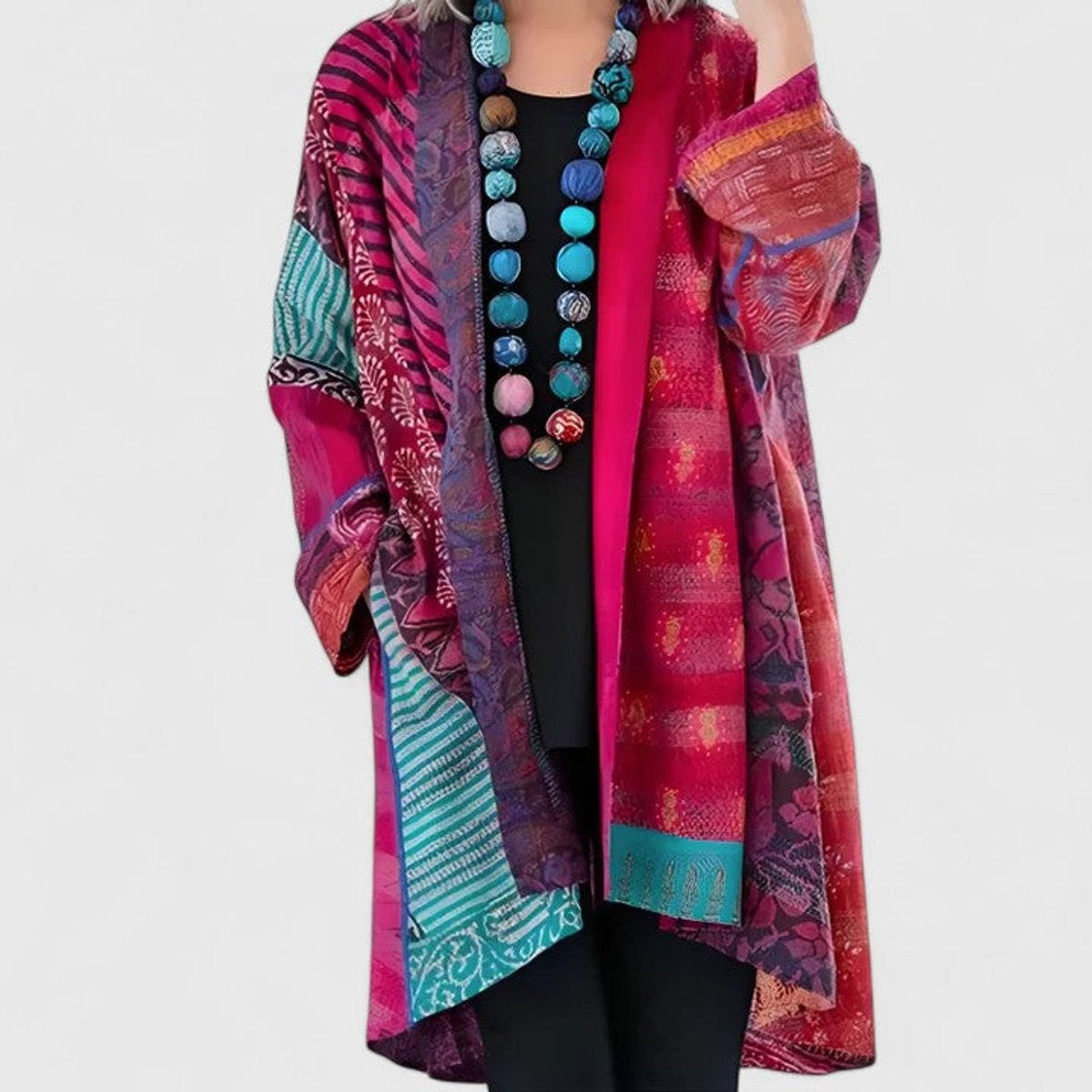 Women's open-front patchwork longline cardigan with patterned panels and long sleeves
