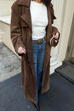 Women's long brown double-breasted trench coat with tie belt