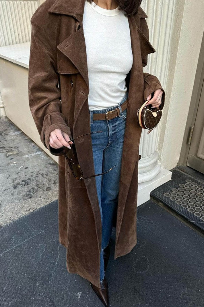 Women's long brown double-breasted trench coat with tie belt