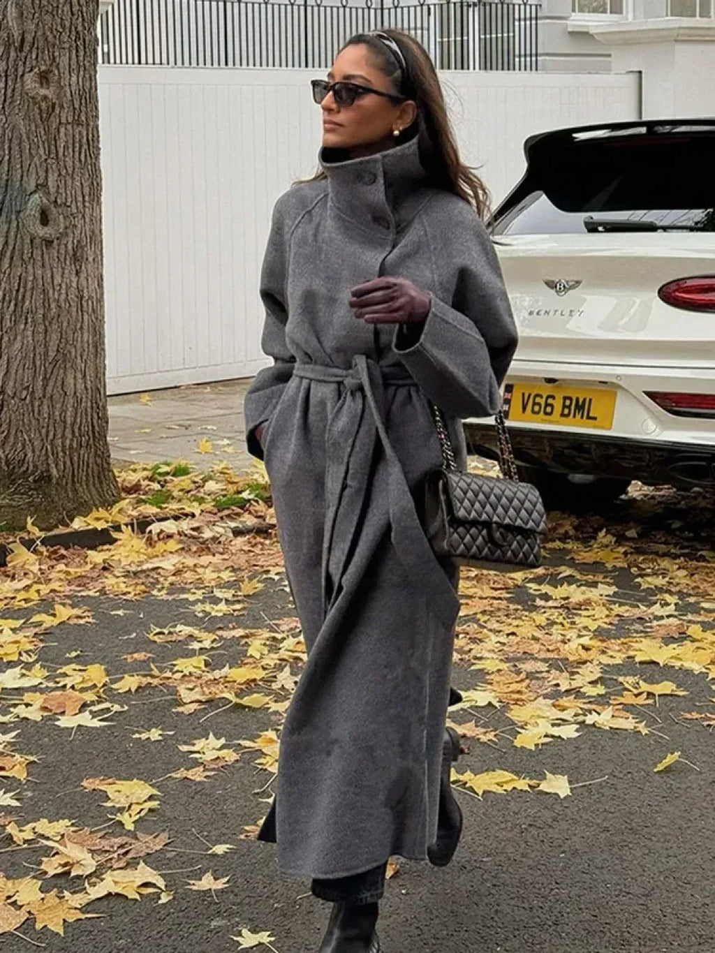 Women's grey long belted coat with stand collar and button front