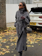 Women's grey long belted coat with stand collar and button front