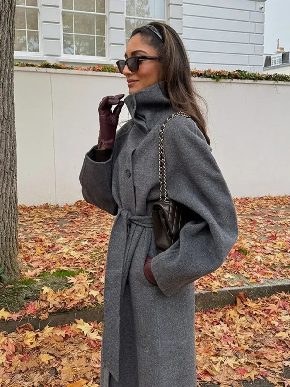 Women's grey long belted coat with stand collar and button front