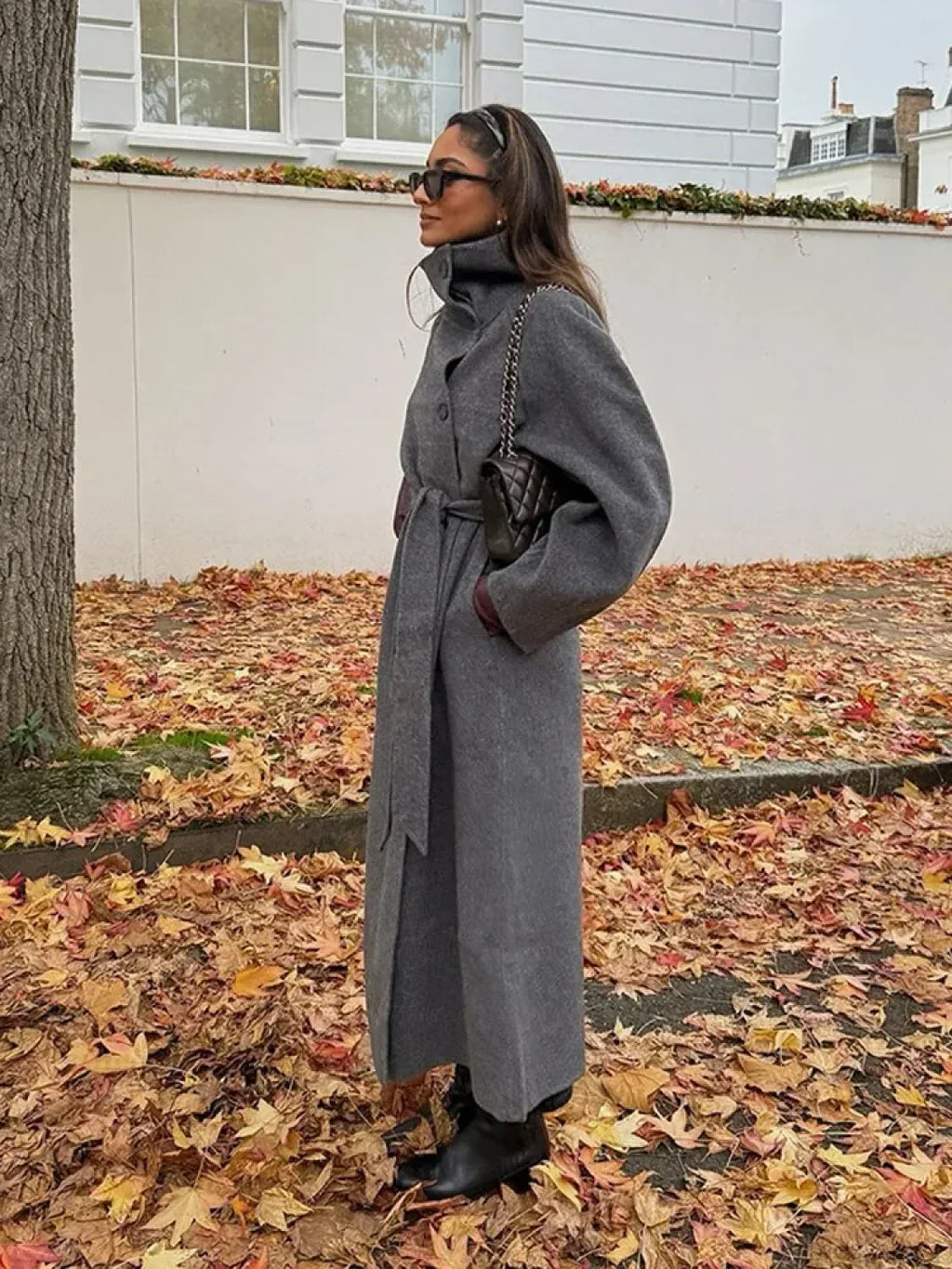 Women's grey long belted coat with stand collar and button front