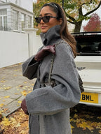 Women's grey long belted coat with stand collar and button front