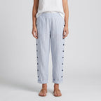 Women's striped cropped trousers with button side panels and turned-up cuffs