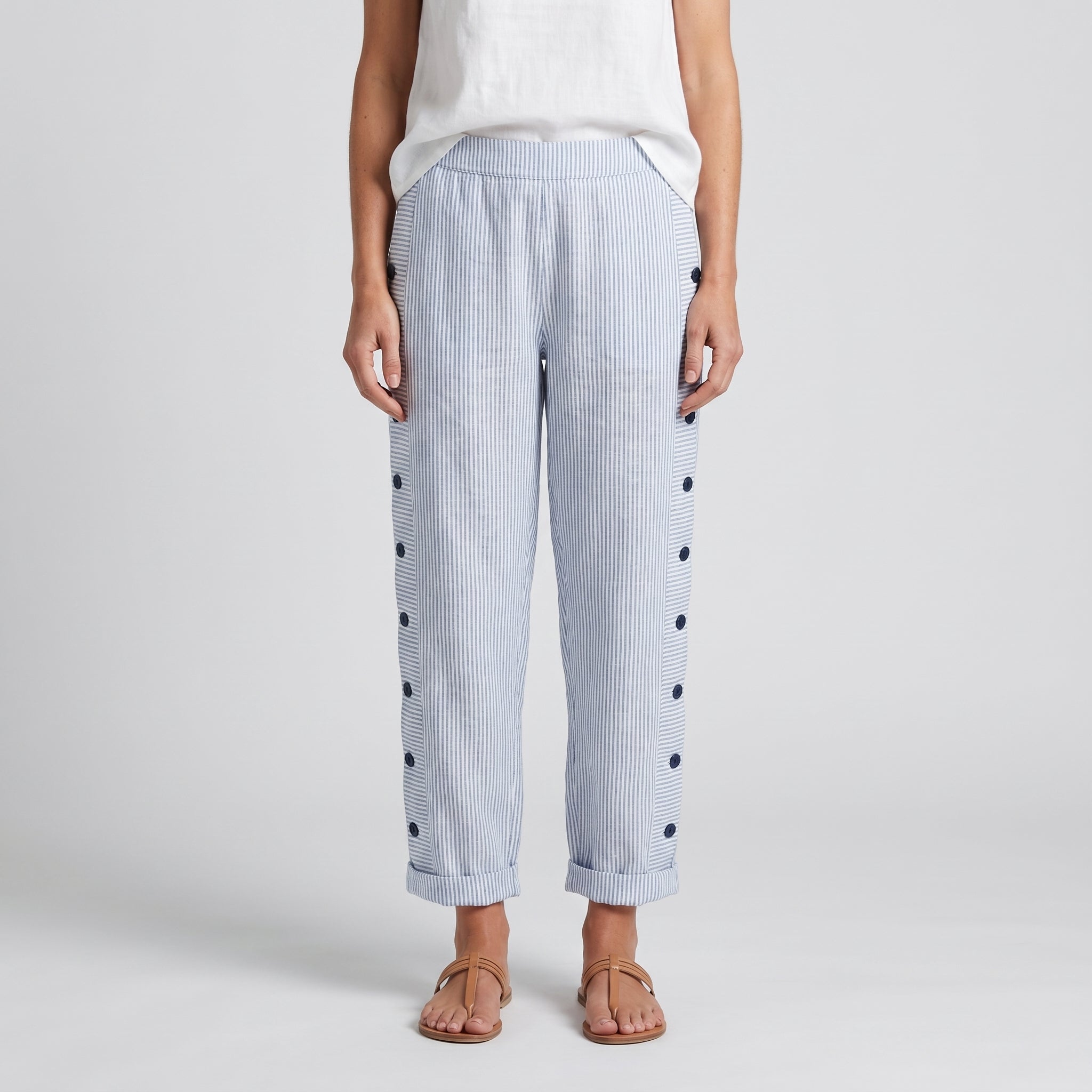Women's striped cropped trousers with button side panels and turned-up cuffs