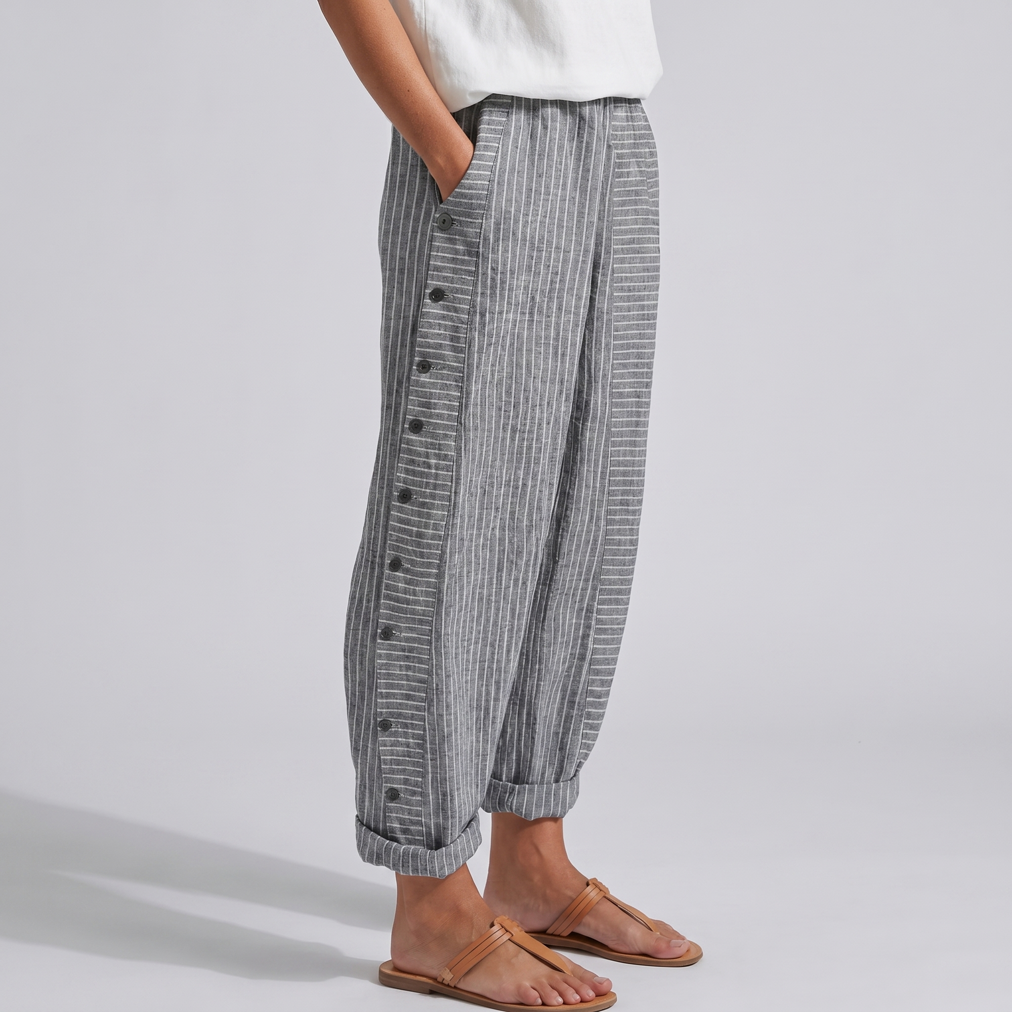 Women's striped cropped trousers with button side panels and turned-up cuffs