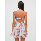 Women's floral strapless mini dress with gathered bodice and ruffle hem