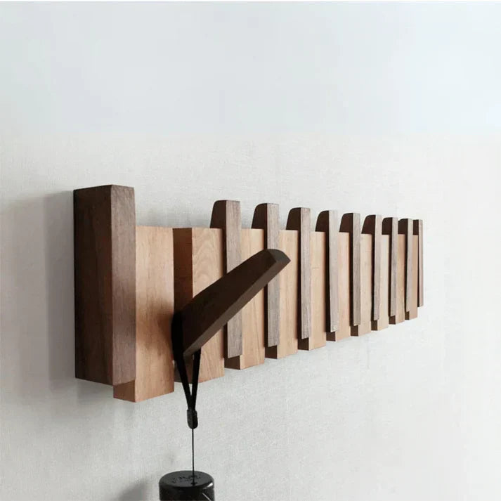 Wooden piano key wall coat rack with fold-down hooks