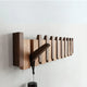 Wooden piano key wall coat rack with fold-down hooks