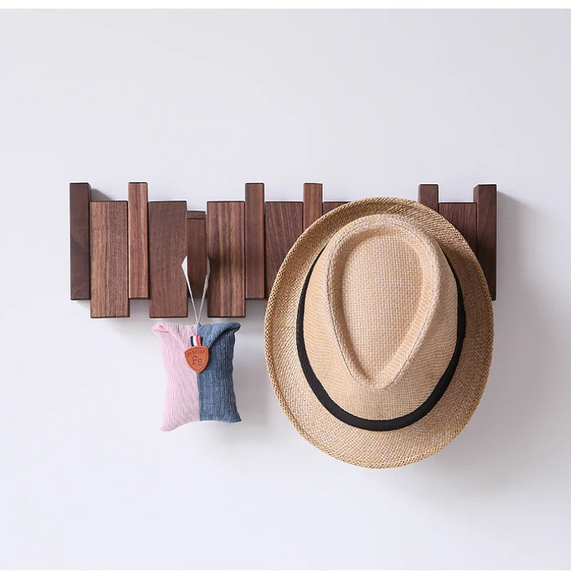 Wooden piano key wall coat rack with fold-down hooks
