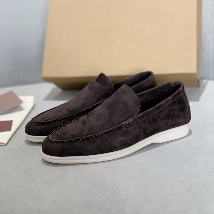 Men's slip-on loafers with textured uppers, moc toe stitching and white flat soles