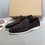 Men's slip-on loafers with textured uppers, moc toe stitching and white flat soles