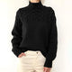 Women's cable knit turtleneck sweater with long sleeves